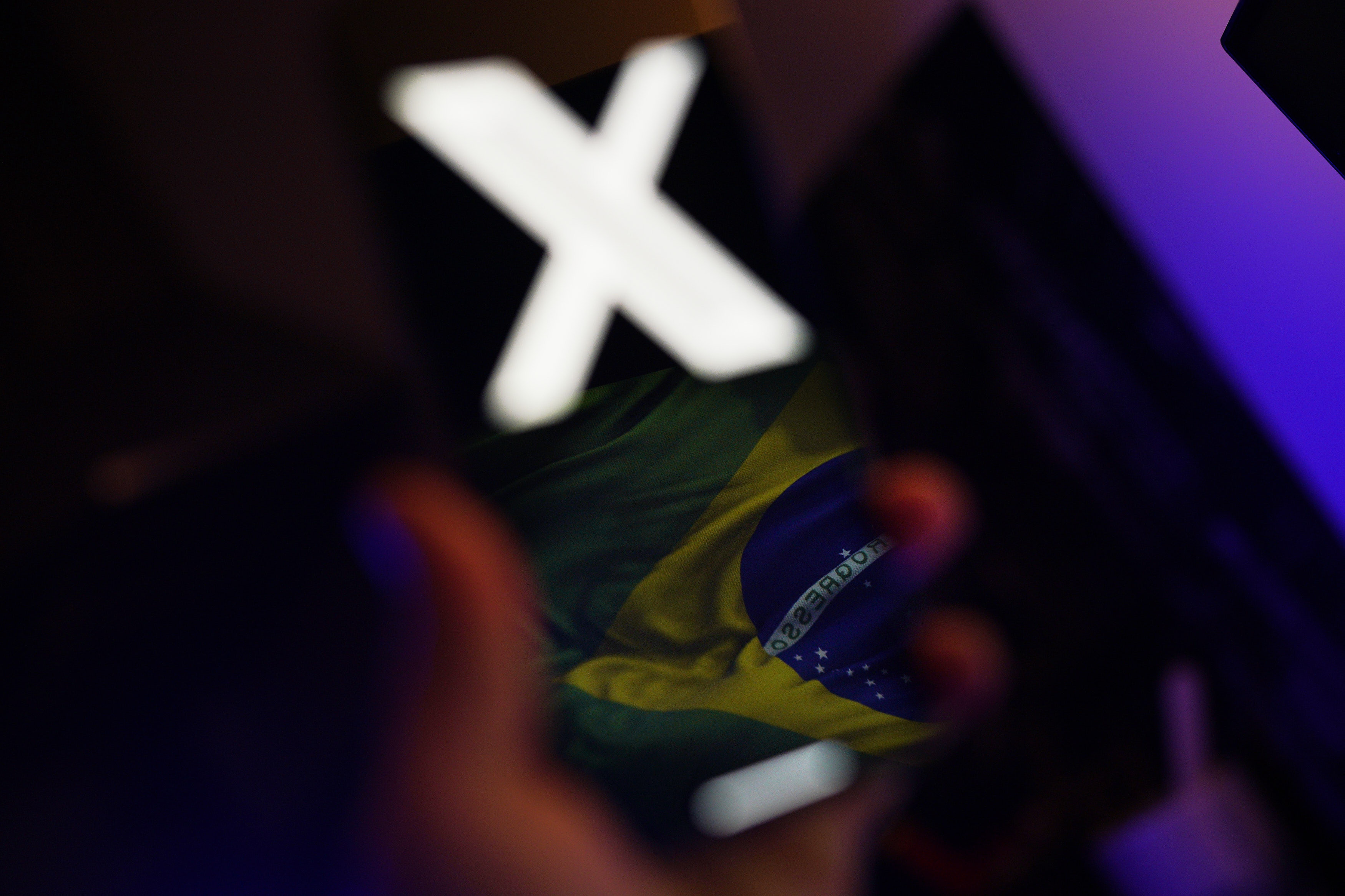 Brazilian flag reflected on a phone screen