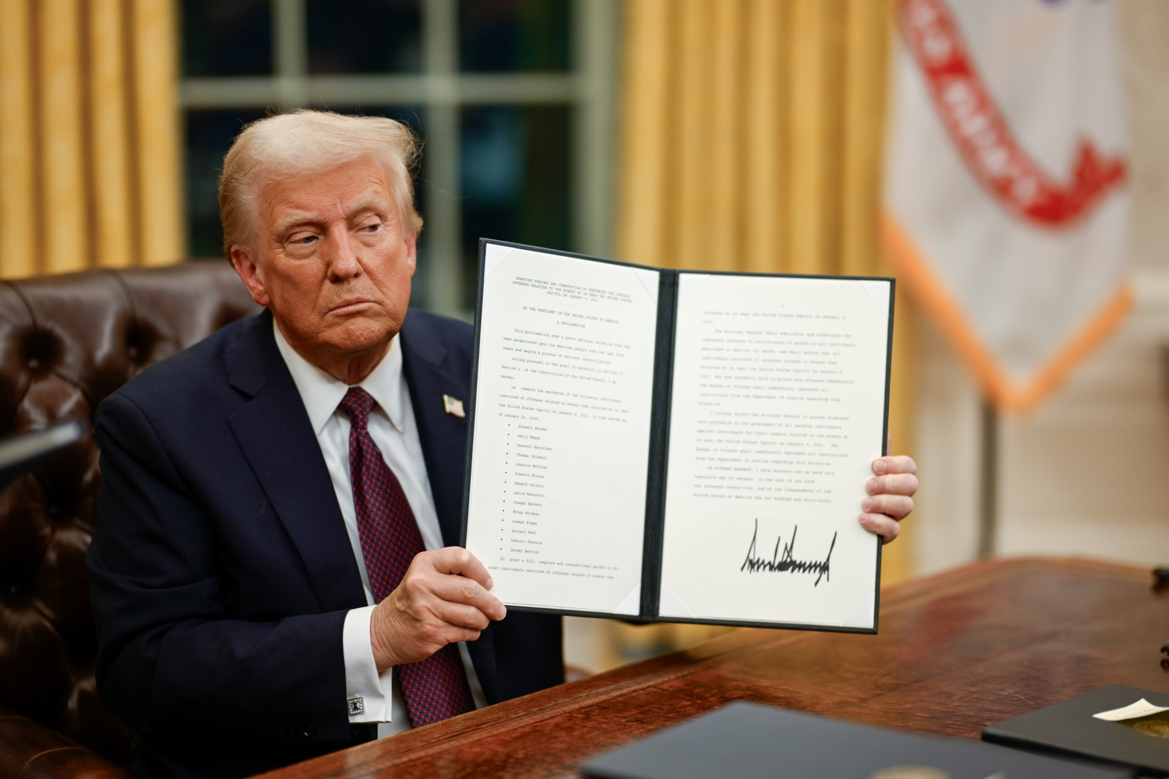 President Trump with an Executive Order. (White House on X)