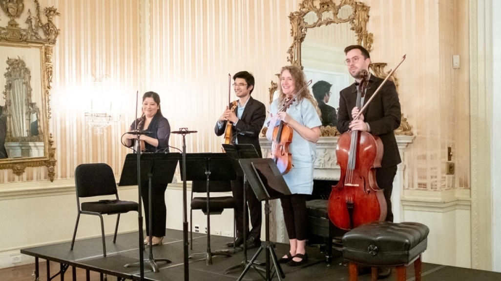 Momenta Quartet members standing on the stage